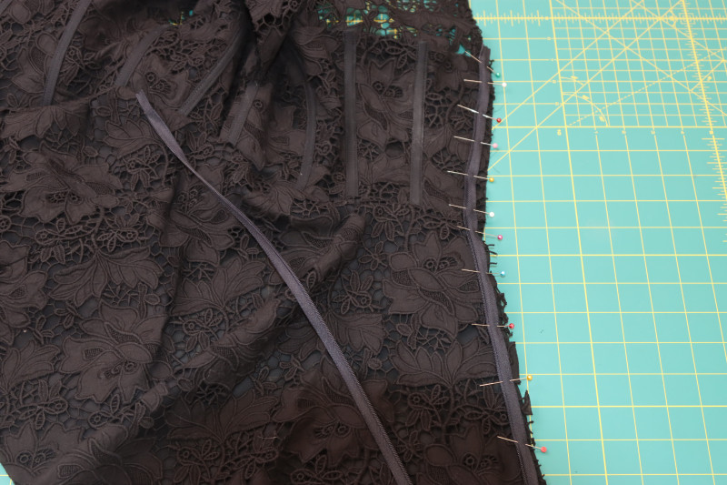 How To Pin One Side Of Zipper To One Side Of Center Back Opening - Invisible Zipper - Mood Fabrics - Reims Soirée Dress Free Sewing Pattern Tutorial - MDF521 - Mood Fabrics Sewciety Blog - Pin one side of the zipper to one side of the center back opening.