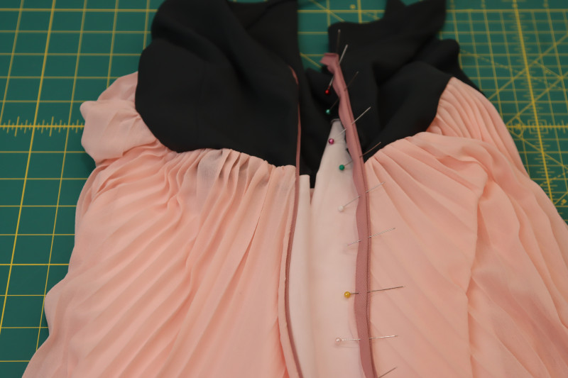 How To Pin Other Side Of Zipper Tape To Main Fabric On Other Side Of Side Seam - Invisible Zipper - Mood Fabrics - Pyrite Pleated Dress Free Sewing Pattern Tutorial - MDF527 - Mood Fabrics Sewciety Blog - Pin the other side of the zipper tape to the main fabric on the other side of the side seam.