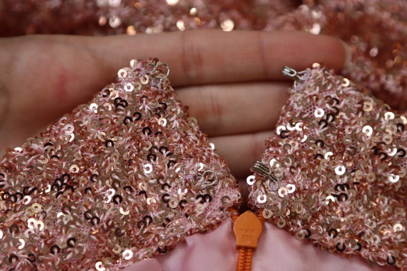 How To Sew Hook And Eye Closures To Center Back Waistband Opening - Hook And Eye Closure - Mood Fabrics - Morganite Waistcoat Ensemble Free Sewing Pattern Tutorial - MDF519 - Mood Fabrics Sewciety Blog - Hand sew hook and eye closures to the center back waistband opening.