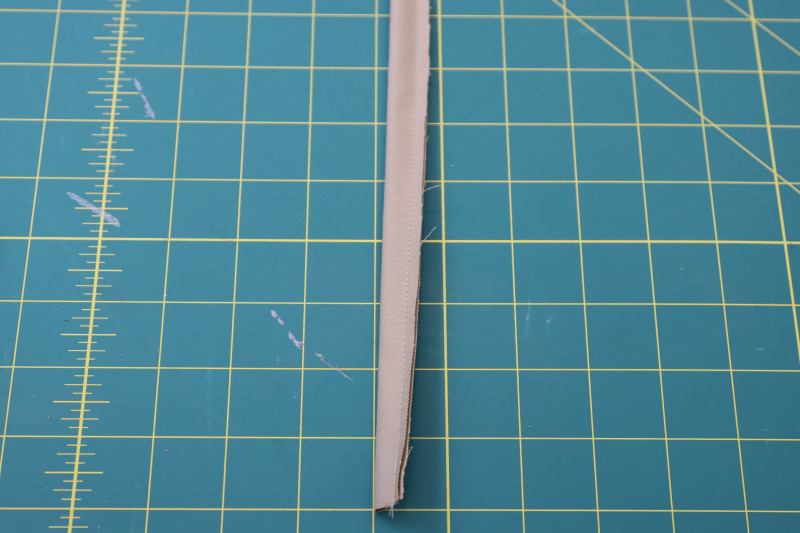 How To Sew Strip Into Tube With ¼ Inch Seam Allowance - Stretch Khaki Twill - Mood Fabrics - Lucca Tailored Barrel Leg Pants Free Sewing Pattern Tutorial - MDF524 - Mood Fabrics Sewciety Blog - Sew the strip into a tube with a ¼ inch seam allowance.