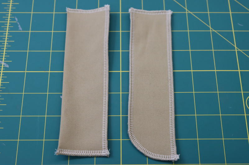 How To Serge Raw Edges Of Fly Pieces - Stretch Khaki Twill - Mood Fabrics - Lucca Tailored Barrel Leg Pants Free Sewing Pattern Tutorial - MDF524 - Mood Fabrics Sewciety Blog - Serge the raw edges of the fly pieces.