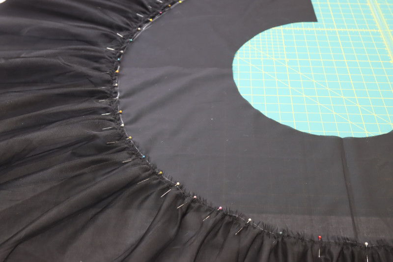How To Pin Gathered Tulle To Chalk Line On Petticoat - Nylon Tulle - Mood Fabrics - Reims Soirée Dress Free Sewing Pattern Tutorial - MDF521 - Mood Fabrics Sewciety Blog - Pin the gathered tulle to the chalk line on the petticoat.