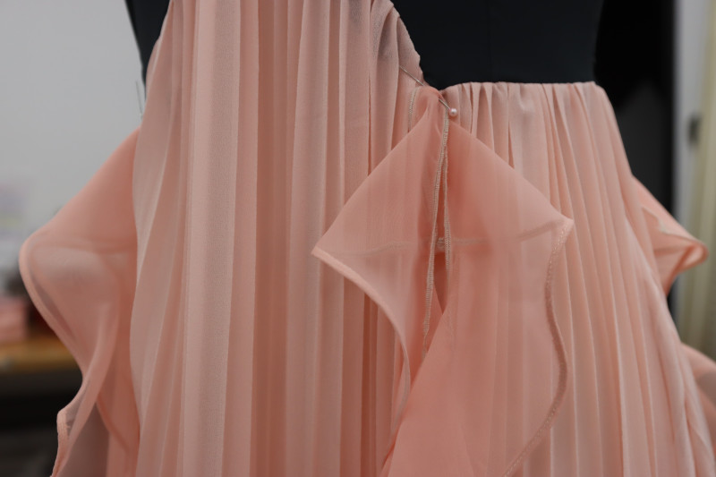 How To Pin Ends Of Ruffles To Corners Of Bodice - Polester Chiffon - Mood Fabrics - Pyrite Pleated Dress Free Sewing Pattern Tutorial - MDF527 - Mood Fabrics Sewciety Blog - Pin the ends of the ruffles to the corners of the bodice.