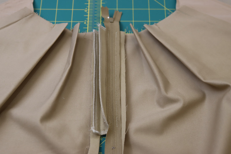 How To Pin Sew Opposite Side Of Zipper To Wearer’s Right Side Of Pants - Regular Zipper - Mood Fabrics - Lucca Tailored Barrel Leg Pants Free Sewing Pattern Tutorial - MDF524 - Mood Fabrics Sewciety Blog - Pin and sew the opposite side of the zipper to the wearer’s right side of the pants.