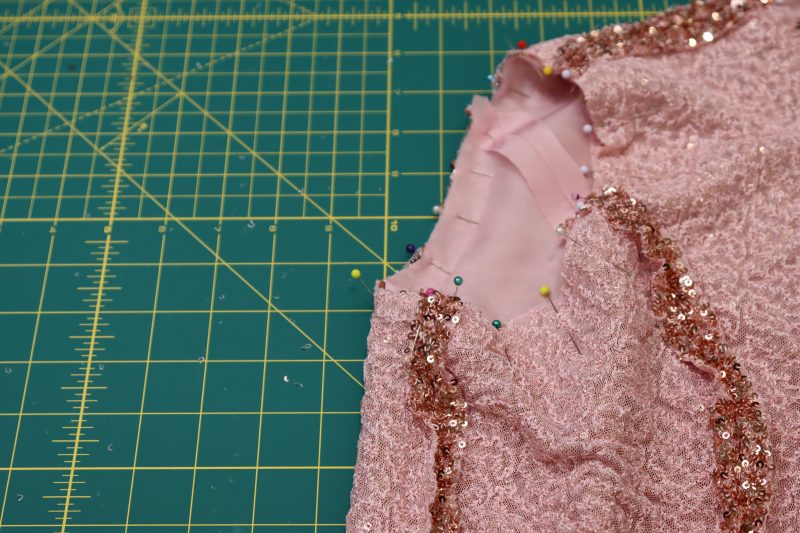 How To Pin Fabric Right Sides Together At The Armscye - Baby Sequin Mesh - Mood Fabrics - Morganite Waistcoat Ensemble Free Sewing Pattern Tutorial - MDF519 - Mood Fabrics Sewciety Blog - Pin the fabric right sides together at the armscye.
