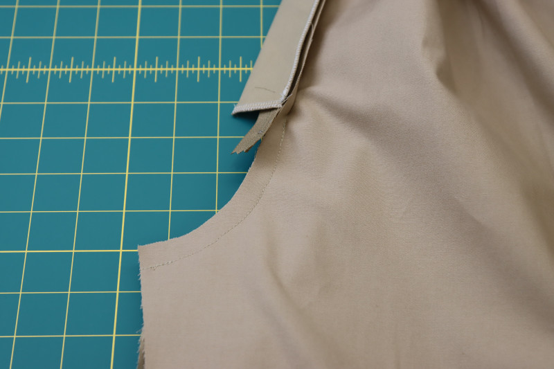 How To Pin Sew Front Crotch Seam Under Zipper - Stretch Khaki Twill - Mood Fabrics - Lucca Tailored Barrel Leg Pants Free Sewing Pattern Tutorial - MDF524 - Mood Fabrics Sewciety Blog - Pin and sew the front crotch seam under the zipper.
