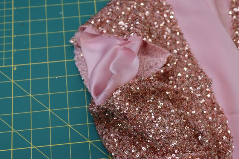 How To Pinch Fabric Right Sides Together At The Armscye - Baby Sequin Mesh - Mood Fabrics - Morganite Waistcoat Ensemble Free Sewing Pattern Tutorial - MDF519 - Mood Fabrics Sewciety Blog - Pinch the fabric right sides together at the armscye.