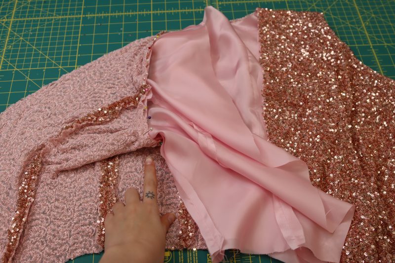 How To Pull Armscyes Out From The Hem And Pin Them Right Sides Together - Baby Sequin Mesh - Mood Fabrics - Morganite Waistcoat Ensemble Free Sewing Pattern Tutorial - MDF519 - Mood Fabrics Sewciety Blog - Pull the armscyes out from the hem and pin them right sides together.