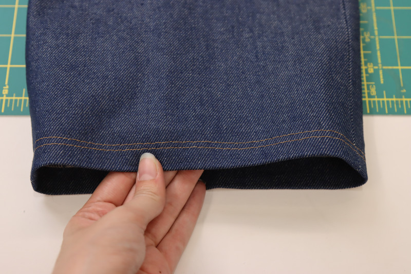 How To Hem Pants Hem Contrast Stitching - Gutermann Sew All Thread - Mood Fabrics - Merit Jumpsuit Free Sewing Pattern Tutorial - MDF525 - Mood Fabrics Sewciety Blog - Hem the pants with contrasting stitching.
