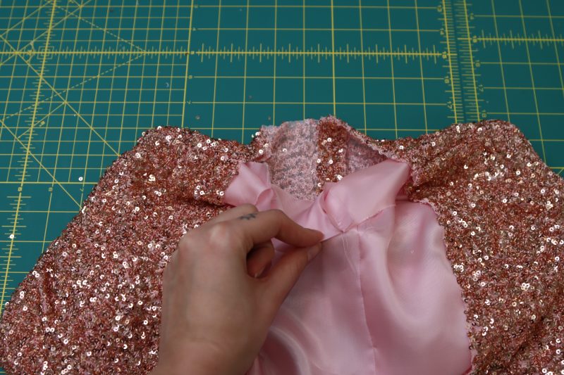 How To Separate Lining From The Main Fabric At The Center Back Neckline - Twill Lining - Mood Fabrics - Morganite Waistcoat Ensemble Free Sewing Pattern Tutorial - MDF519 - Mood Fabrics Sewciety Blog - Separate the lining from the main fabric at the center back neckline.