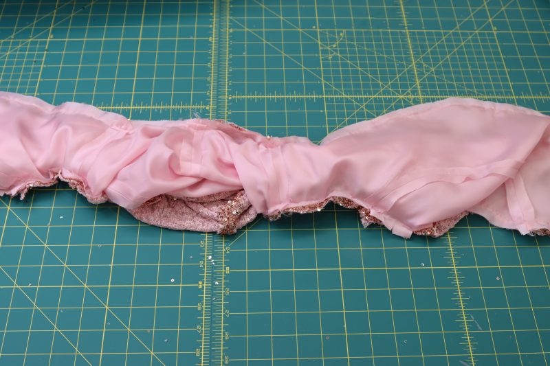 How To Sew Along The Pins Except For The Small Gap - Baby Sequin Mesh - Mood Fabrics - Morganite Waistcoat Ensemble Free Sewing Pattern Tutorial - MDF519 - Mood Fabrics Sewciety Blog - Sew along the pins except for the small gap.