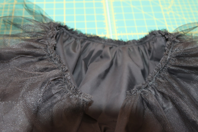 How To Sew Tulle Layer To Petticoat Lining Waistline - Nylon Tulle - Mood Fabrics - Reims Soirée Dress Free Sewing Pattern Tutorial - MDF521 - Mood Fabrics Sewciety Blog - Sew the tulle layer to the petticoat lining waistline.