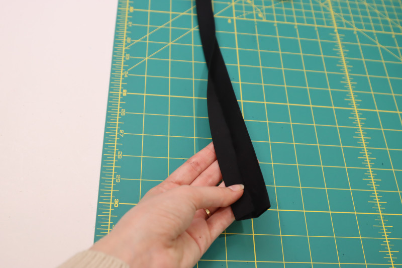 How To Cut Petticoat Waistband Piece - Cotton Voile - Mood Fabrics - Reims Soirée Dress Free Sewing Pattern Tutorial - MDF521 - Mood Fabrics Sewciety Blog - Cut and fold the petticoat waistband piece.
