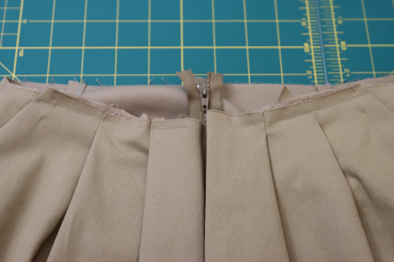 How To Topstitch Pocket Bag To Waistline - Stretch Khaki Twill - Mood Fabrics - Lucca Tailored Barrel Leg Pants Free Sewing Pattern Tutorial - MDF524 - Mood Fabrics Sewciety Blog - Topstitch the pocket bag to the waistline.
