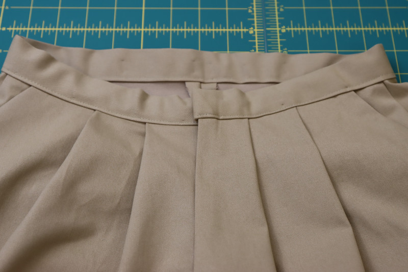 How To Sew Waistband To Pants With ⅛ Inch Seam Allowance - Gutermann Sew All Thread - Mood Fabrics - Lucca Tailored Barrel Leg Pants Free Sewing Pattern Tutorial - MDF524 - Mood Fabrics Sewciety Blog - Sew the waistband to the pants with ⅛ inch seam allowance.
