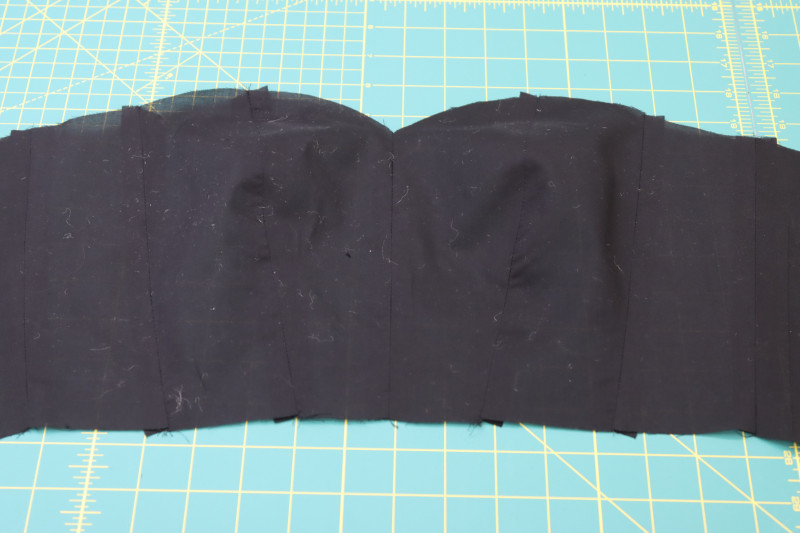 How To Press Corset Lining Seams Open And Flat - Cotton Voile - Mood Fabrics - Reims Soirée Dress Free Sewing Pattern Tutorial - MDF521 - Mood Fabrics Sewciety Blog - Press the corset lining seams open and flat.