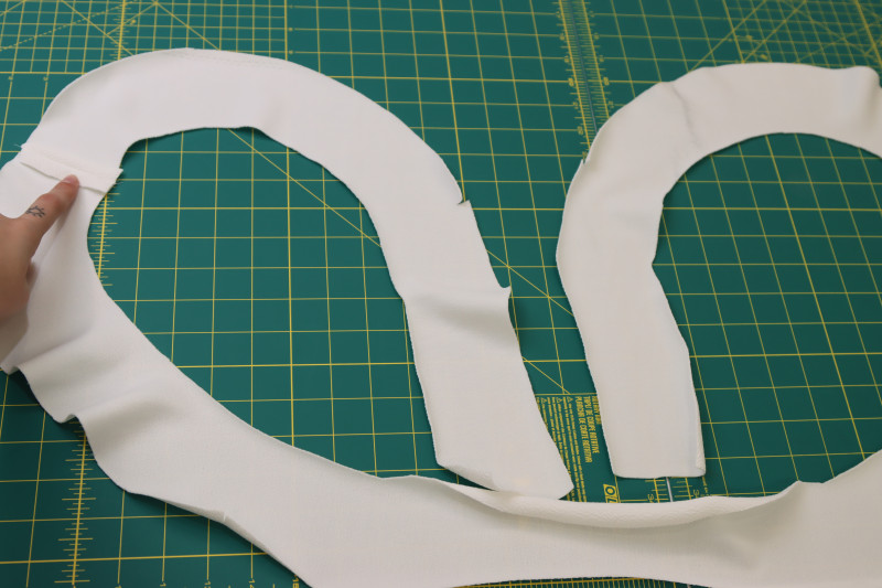 How To Press Facing Seams Open And Flat - Stretch Liverpool Knit - Mood Fabrics - Merano Balloon Sleeve Blouse Free Sewing Pattern Tutorial - MDF522 - Mood Fabrics Sewciety Blog - Press the facing seams open and flat.