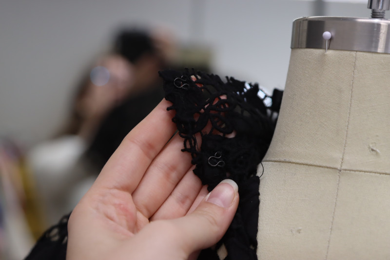 How To Sew Eye Closures On Center Back Collar By Hand - Hook And Eye Closures - Mood Fabrics - Reims Soirée Dress Free Sewing Pattern Tutorial - MDF521 - Mood Fabrics Sewciety Blog - Hand sew eye closures on the center back collar.