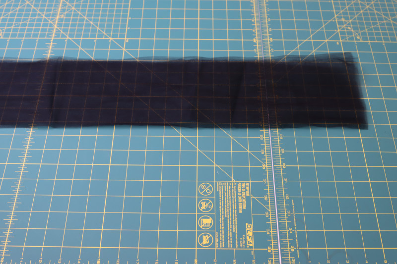 How To Cut Pieces Of Tulle For Ankle Cuffs - Nylon Tulle - Mood Fabrics - Reims Soirée Dress Free Sewing Pattern Tutorial - MDF521 - Mood Fabrics Sewciety Blog - Cut pieces of tulle for the ankle cuffs.