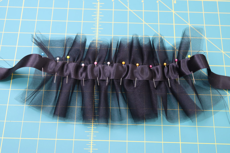 How To Pin Satin Ribbon To Gathered Tulle - Satin Ribbon - Mood Fabrics - Reims Soirée Dress Free Sewing Pattern Tutorial - MDF521 - Mood Fabrics Sewciety Blog - Pin the satin ribbon to the gathered tulle.