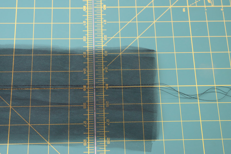 How To Sew Gathering Stitches In Middle Of Tulle Strips - Gutermann Sew All Thread - Mood Fabrics - Reims Soirée Dress Free Sewing Pattern Tutorial - MDF521 - Mood Fabrics Sewciety Blog - Sew gathering stitches in the middle of the tulle strips.