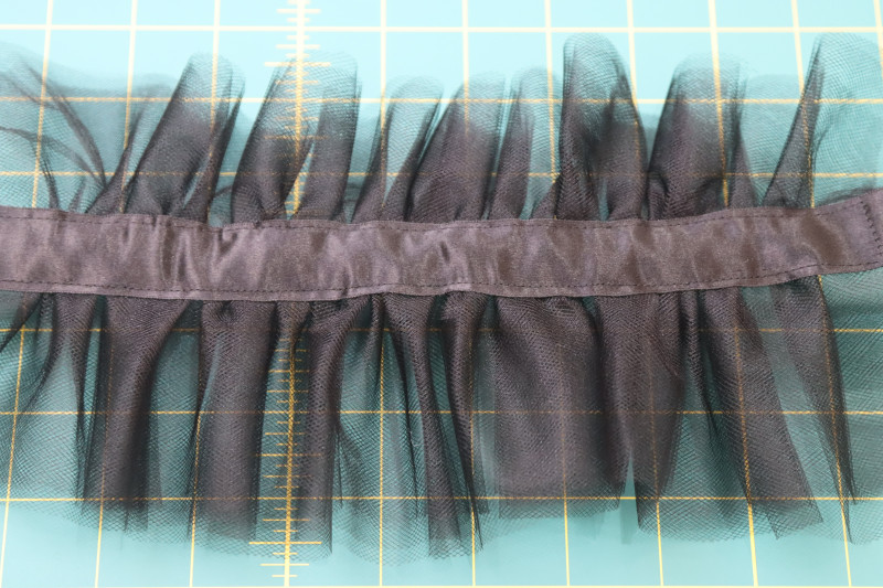 How To Topstitch Ribbon To Gathered Tulle - Satin Ribbon - Mood Fabrics - Reims Soirée Dress Free Sewing Pattern Tutorial - MDF521 - Mood Fabrics Sewciety Blog - Topstitch the ribbon to the gathered tulle.