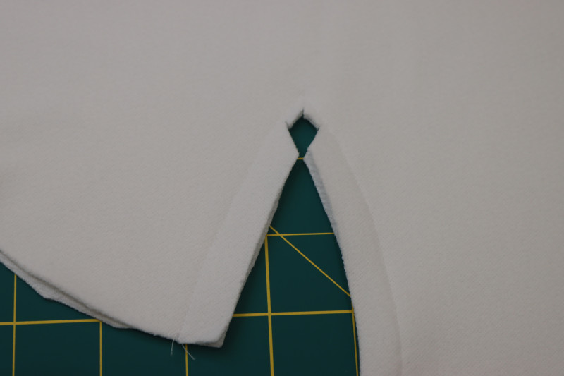 How To Clip Inner Corner Of The Sleeve - Stretch Liverpool Knit - Mood Fabrics - Merano Balloon Sleeve Blouse Free Sewing Pattern Tutorial - MDF522 - Mood Fabrics Sewciety Blog - Clip the inner corner of the sleeve.