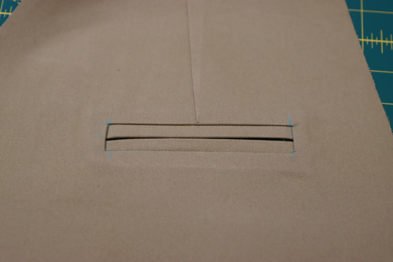 How To Flip Welt Toward Wrong Side Of Fabric - Stretch Khaki Twill - Mood Fabrics - Lucca Tailored Barrel Leg Pants Free Sewing Pattern Tutorial - MDF524 - Mood Fabrics Sewciety Blog - Flip the welt toward the wrong side of the fabric.