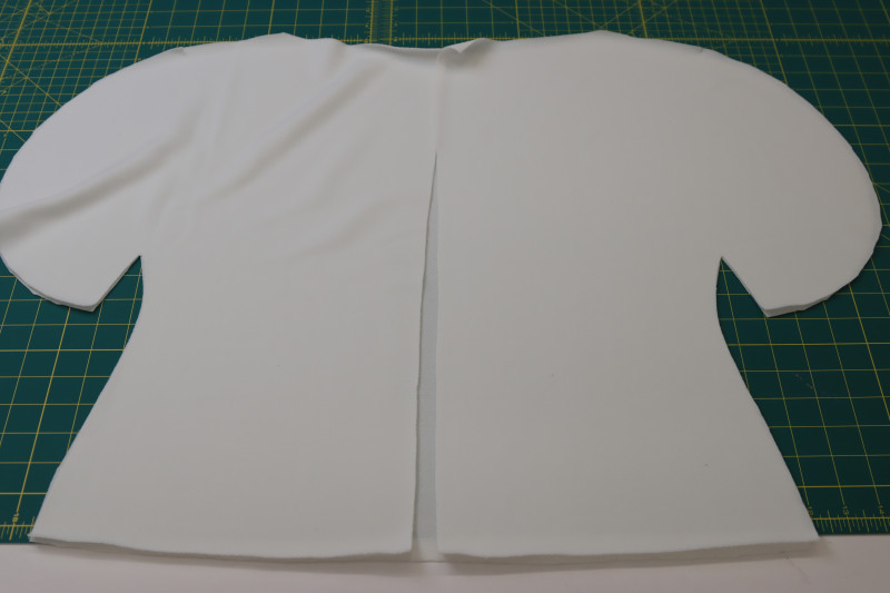 How To Layout Back Blouse Pieces Right Sides Together On Top Of The Front Blouse Piece - Stretch Liverpool Knit - Mood Fabrics - Merano Balloon Sleeve Blouse Free Sewing Pattern Tutorial - MDF522 - Mood Fabrics Sewciety Blog - Layout the back blouse pieces right sides together on top of the front blouse piece.