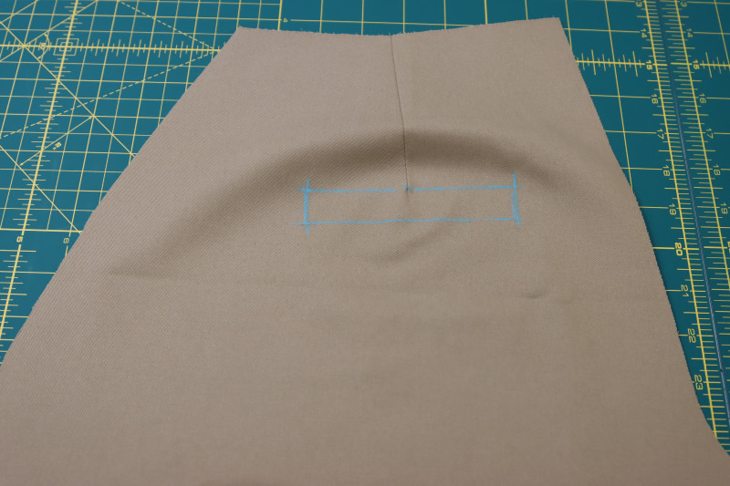 How To Mark Location Of Welt Pockets Under Back Darts - Stretch Khaki Twill - Mood Fabrics - Lucca Tailored Barrel Leg Pants Free Sewing Pattern Tutorial - MDF524 - Mood Fabrics Sewciety Blog - Mark the location of the welt pockets under the back darts.