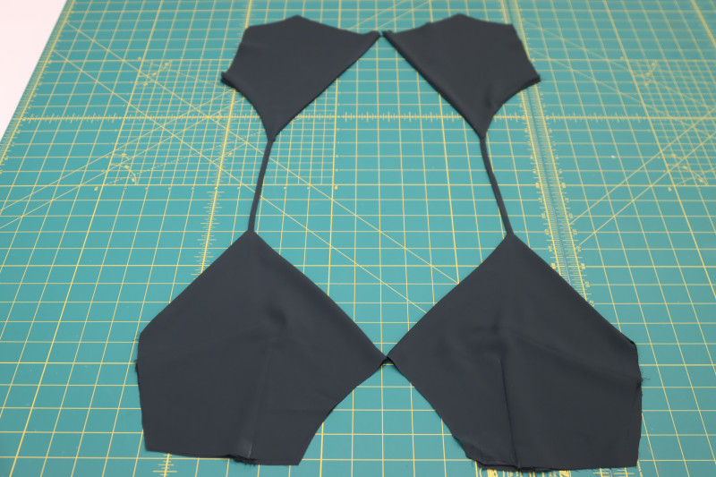 How To Press Back Neckline Seams Flat - Double Polyester Georgette - Mood Fabrics - Pyrite Pleated Dress Free Sewing Pattern Tutorial - MDF527 - Mood Fabrics Sewciety Blog - Press the back neckline seams flat.