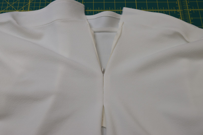 How To Close Zipper To Make Sure It Closes - Invisible Zipper - Mood Fabrics - Merano Balloon Sleeve Blouse Free Sewing Pattern Tutorial - MDF522 - Mood Fabrics Sewciety Blog - Zip the zipper to make sure it closes.