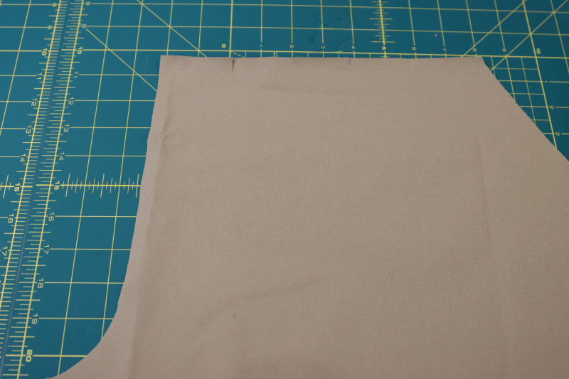 How To Cut Notches For Waistline Pleats - Stretch Khaki Twill - Mood Fabrics - Lucca Tailored Barrel Leg Pants Free Sewing Pattern Tutorial - MDF524 - Mood Fabrics Sewciety Blog - Cut the notches for the waistline pleats.