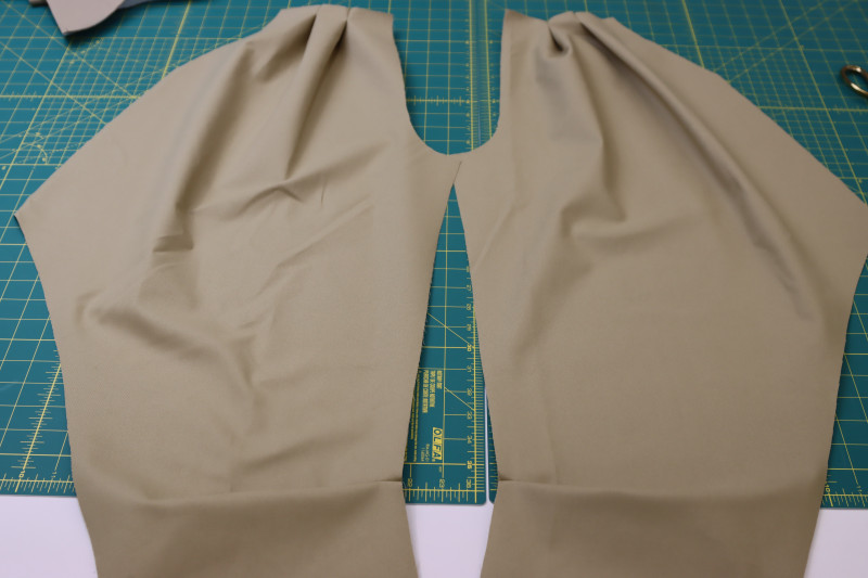How To Pin Sew Pleats On Front Pant Legs - Stretch Khaki Twill - Mood Fabrics - Lucca Tailored Barrel Leg Pants Free Sewing Pattern Tutorial - MDF524 - Mood Fabrics Sewciety Blog - Pin and sew the pleats on the front pant legs.