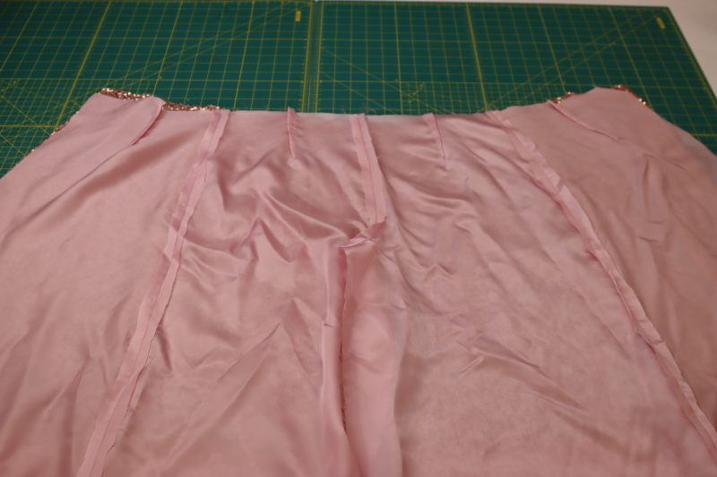 How To Place Lining Pants And Sequined Pants Right Sides Together - Twill Lining - Mood Fabrics - Morganite Waistcoat Ensemble Free Sewing Pattern Tutorial - MDF519 - Mood Fabrics Sewciety Blog - Place the lining pants and the sequined pants right sides together.