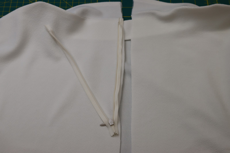 How To Sew First Side Of The Zipper Tape Down - Invisible Zipper - Mood Fabrics - Merano Balloon Sleeve Blouse Free Sewing Pattern Tutorial - MDF522 - Mood Fabrics Sewciety Blog - Sew the first side of the zipper tape down.