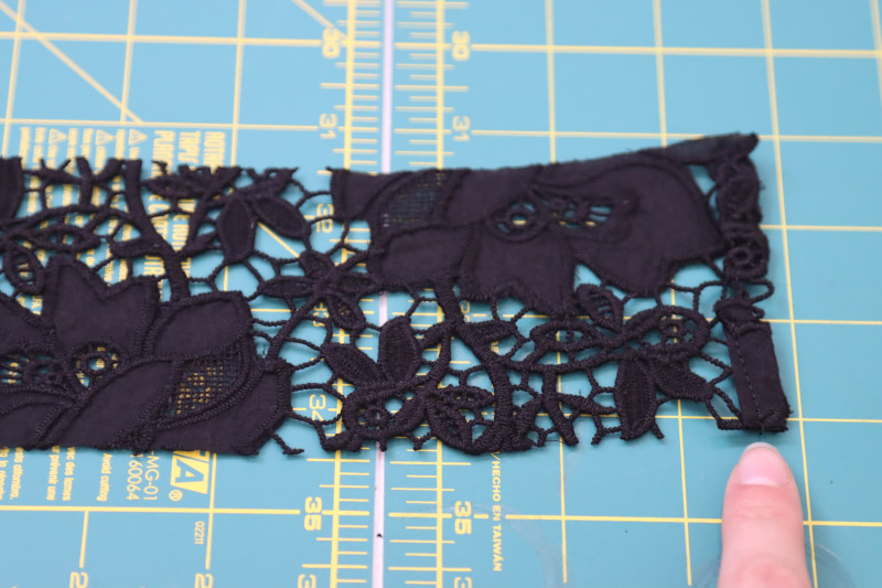 How To Sew Rolled Hem On Center Back Of Collar - Floral Guipure Lace - Mood Fabrics - Reims Soirée Dress Free Sewing Pattern Tutorial - MDF521 - Mood Fabrics Sewciety Blog - Sew a rolled hem on the center back of the collar.
