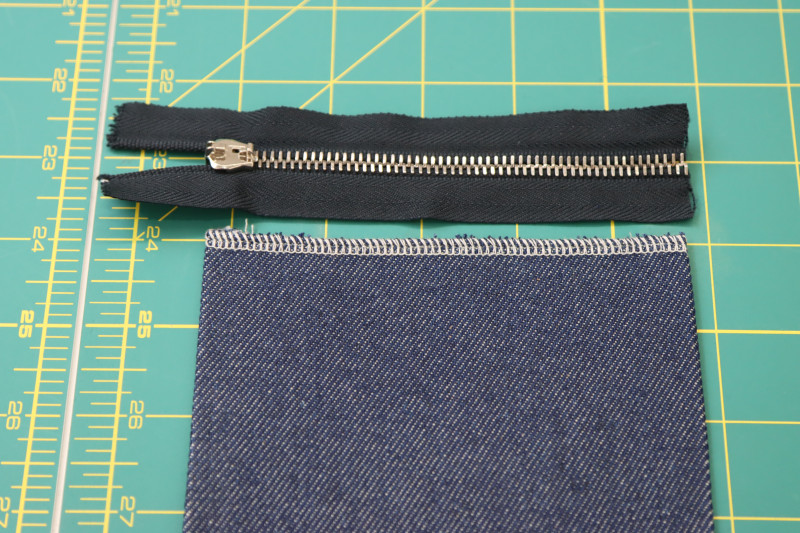 How To Cut Zipper Cut To Length Of Breast Pocket - 9 Inch Zipper - Mood Fabrics - Merit Jumpsuit Free Sewing Pattern Tutorial - MDF525 - Mood Fabrics Sewciety Blog - Cut the zipper to the length of the breast pocket.