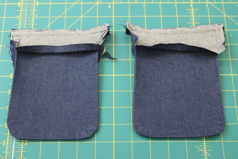 How To Pin Sew Upper Pocket Pieces Attached To Zipper - 9 Inch Zipper - Mood Fabrics - Merit Jumpsuit Free Sewing Pattern Tutorial - MDF525 - Mood Fabrics Sewciety Blog - Pin and sew the upper pocket pieces right sides together on top of the zippers.