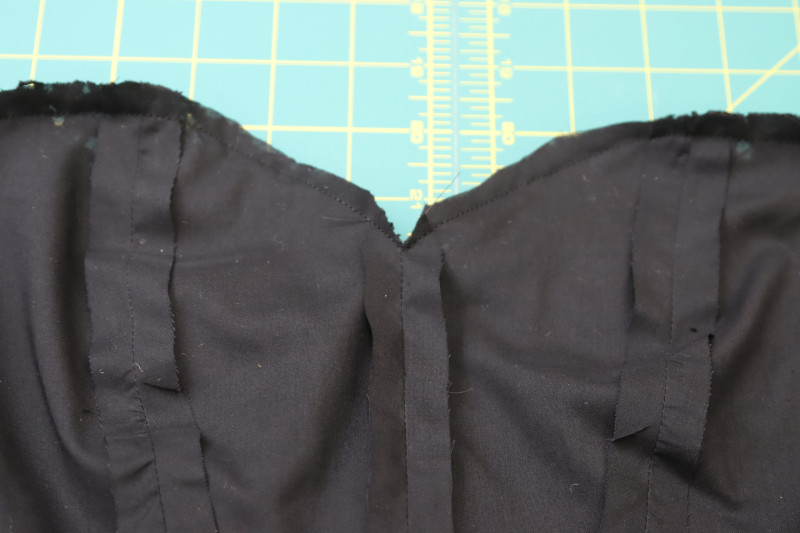 How To Clip Center Front Corner Of Neckline - Cotton Voile - Mood Fabrics - Reims Soirée Dress Free Sewing Pattern Tutorial - MDF521 - Mood Fabrics Sewciety Blog - Clip the center front corner of the neckline.