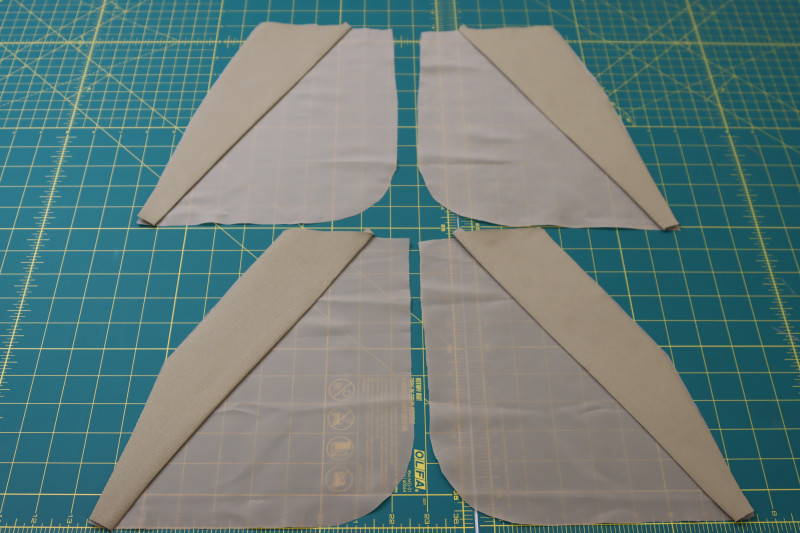 How To Layout A Pocket Facings On A Pocket Linings And B Pocket Facings To B Pocket Linings - Stretch Polester Twill Lining - Mood Fabrics - Lucca Tailored Barrel Leg Pants Free Sewing Pattern Tutorial - MDF524 - Mood Fabrics Sewciety Blog - Layout the A pocket facings on the A pocket linings and the B pocket facings to the B pocket linings.