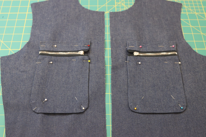 How To Pin Breast Pockets Pinned To Jumpsuit Front - Cotton Denim Twill - Mood Fabrics - Merit Jumpsuit Free Sewing Pattern Tutorial - MDF525 - Mood Fabrics Sewciety Blog - Pin the breast pockets to the top fronts of the jumpsuit.Merit Jumpsuit Free Sewing Pattern Tutorial - MDF525 - Mood Fabrics Sewciety Blog - How To Pin Breast Pockets Pinned To Jumpsuit Front - Cotton Denim Twill - Pin the breast pockets to the top fronts of the jumpsuit.