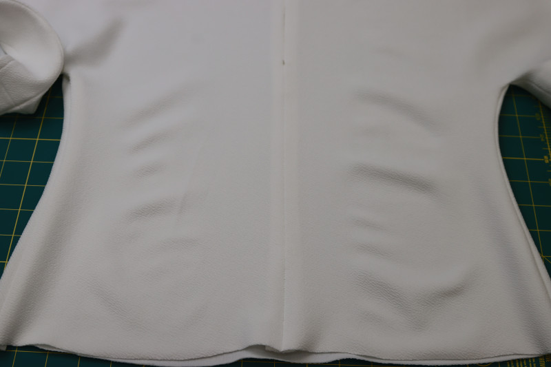 How To Sew Center Back Seam Under The Zipper - Stretch Liverpool Knit - Mood Fabrics - Merano Balloon Sleeve Blouse Free Sewing Pattern Tutorial - MDF522 - Mood Fabrics Sewciety Blog - Sew the center back seam under the zipper.