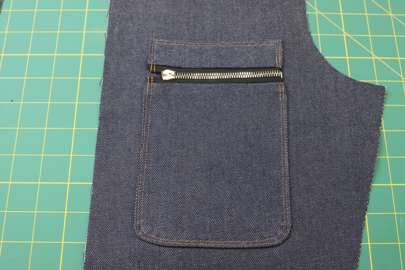 How To Topstitch Breast Pockets Topstitched Gold Thread - Gutermann Sew All Thread - Mood Fabrics - Merit Jumpsuit Free Sewing Pattern Tutorial - MDF525 - Mood Fabrics Sewciety Blog - Topstitch over the breast pockets with the gold contrast thread.