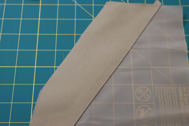 How To Topstitch Pocket Facings To Pocket Linings With ⅛ Inch Seam Allowance - Stretch Polester Twill Lining - Mood Fabrics - Lucca Tailored Barrel Leg Pants Free Sewing Pattern Tutorial - MDF524 - Mood Fabrics Sewciety Blog - Topstitch the pocket facings to the pocket linings with ⅛ inch seam allowance.