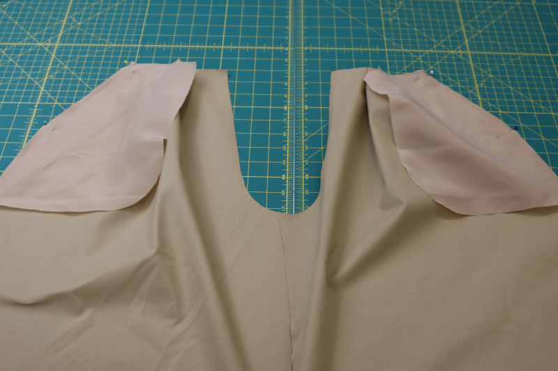 How To Pin A Pocket Bags To Fronts Of Pants - Stretch Polester Twill Lining - Mood Fabrics - Lucca Tailored Barrel Leg Pants Free Sewing Pattern Tutorial - MDF524 - Mood Fabrics Sewciety Blog - Pin the A pocket bags to the fronts of the pants.