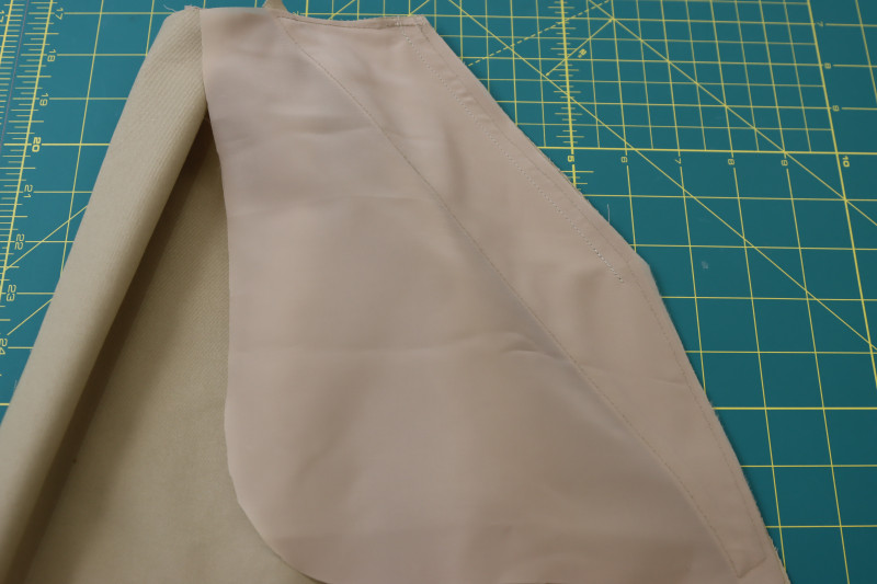 How To Sew A Pocket Bags To Fronts Of Pants But Only Half Way Down Pocket - Stretch Polester Twill Lining - Mood Fabrics - Lucca Tailored Barrel Leg Pants Free Sewing Pattern Tutorial - MDF524 - Mood Fabrics Sewciety Blog - Sew the A pocket bags to the fronts of the pants, but only half way down the pocket.