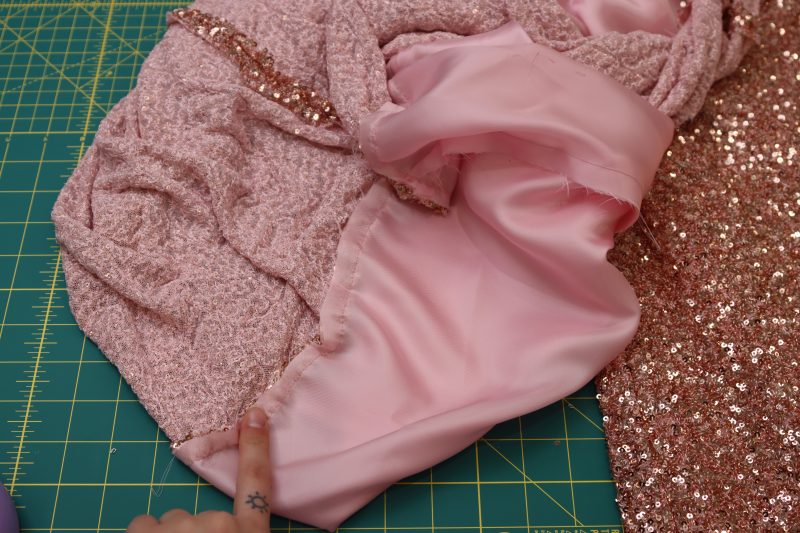 How To Sew Lining To The Main Fabric At The Hem - Twill Lining - Mood Fabrics - Morganite Waistcoat Ensemble Free Sewing Pattern Tutorial - MDF519 - Mood Fabrics Sewciety Blog - Sew the lining to the main fabric at the hem.