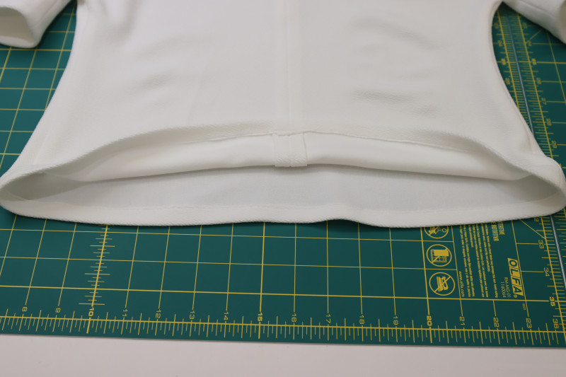 How To Hem Bottom Of The Blouse - Stretch Liverpool Knit - Mood Fabrics - Merano Balloon Sleeve Blouse Free Sewing Pattern Tutorial - MDF522 - Mood Fabrics Sewciety Blog - Hem the bottom of the blouse.