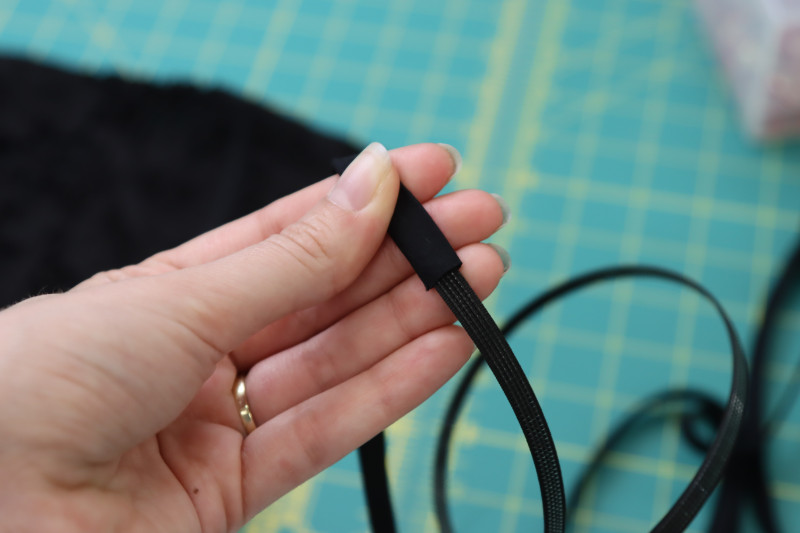 How To Insert Rigilene Boning Into Bias Cut Casing - Rigilene Boning - Mood Fabrics - Reims Soirée Dress Free Sewing Pattern Tutorial - MDF521 - Mood Fabrics Sewciety Blog - Insert the rigilene boning into the bias cut casing.